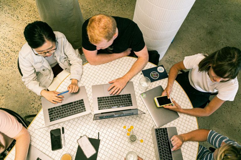 photo of people using laptop